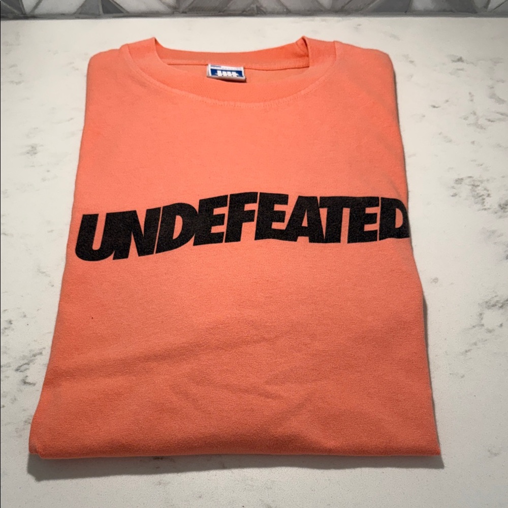 Undefeated Coral Tee with Black logo